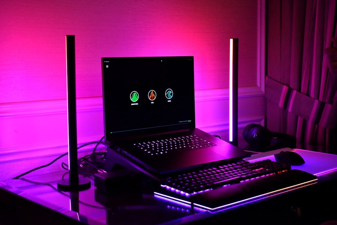 Bright modern office desk with laptop and notebook