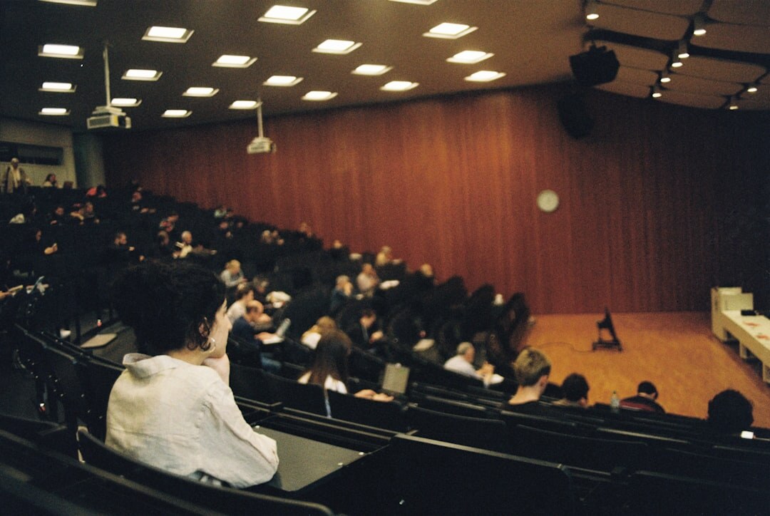 Audience listening attentively during a university lecture