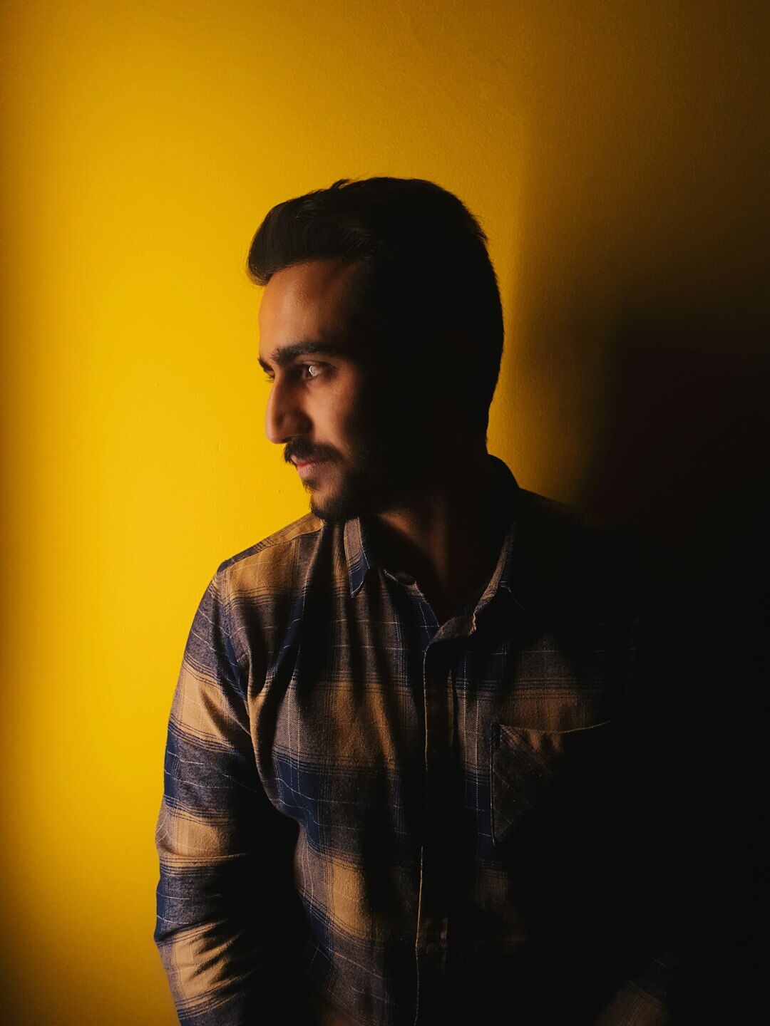 Studio portrait of a young man in a casual shirt