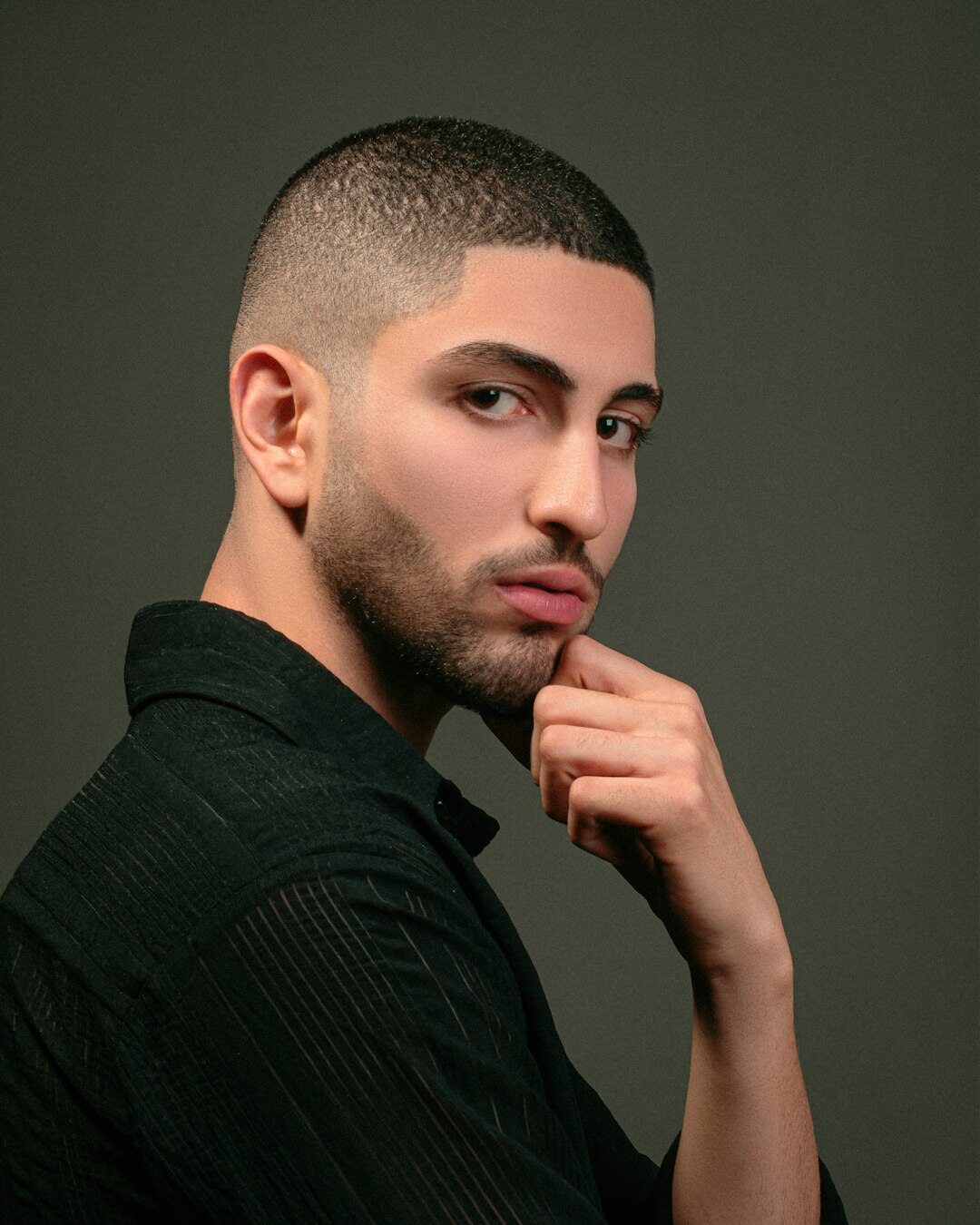 Studio portrait of a young man with short hair