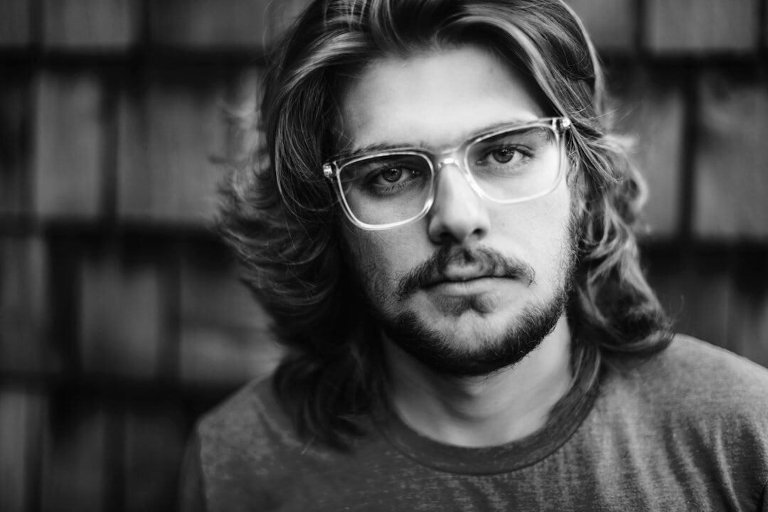 Studio portrait of a man with glasses and a beard