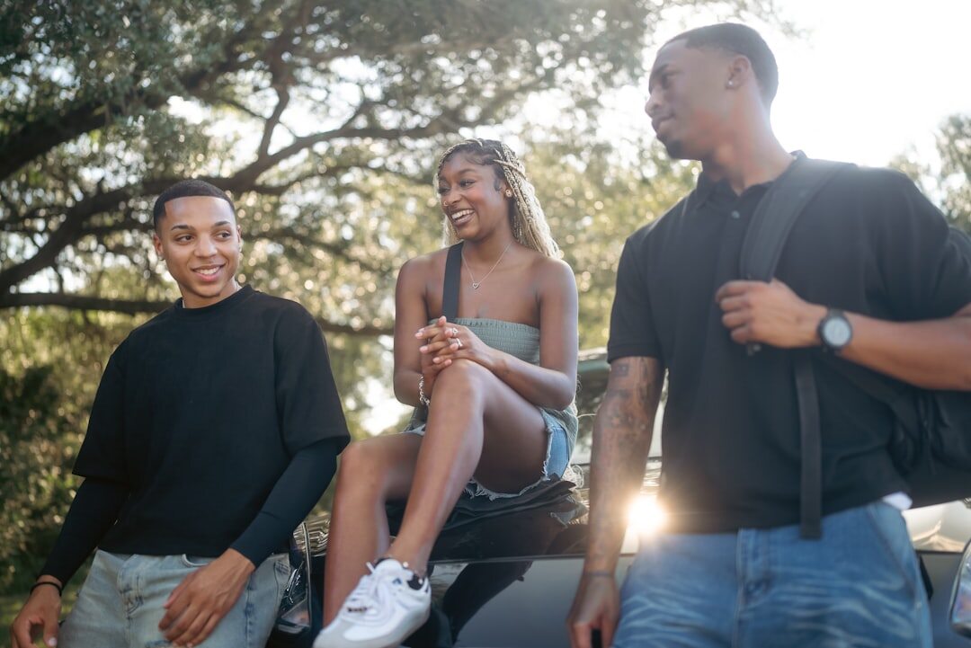 Group of diverse young adults having an animated conversation outdoors